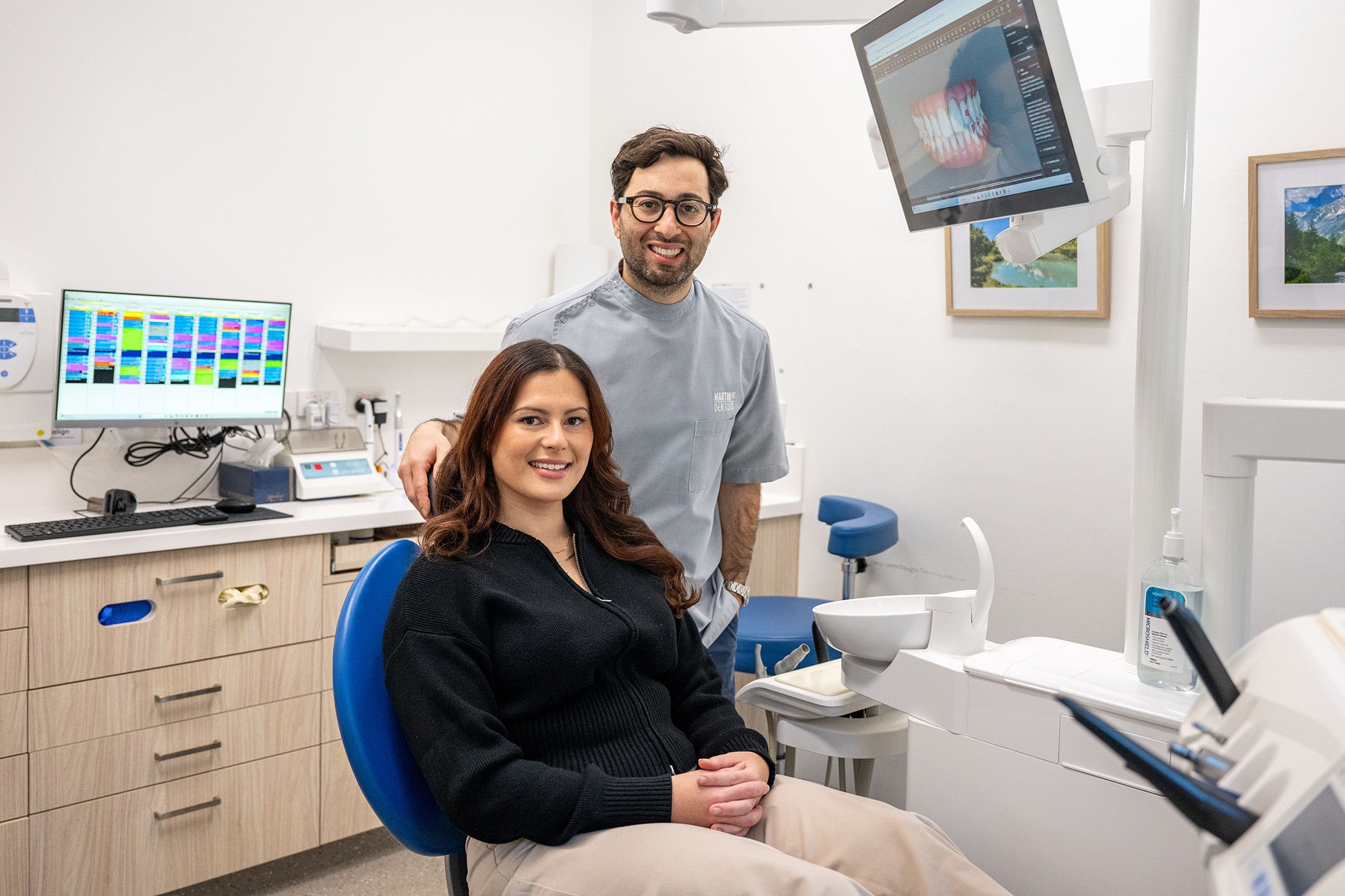 Dr. Adam Sibio of Martin Street Dentists with a patient in his dental room.