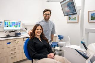 Dr. Adam Sibio of Martin Street Dentists with a patient in his dental room.