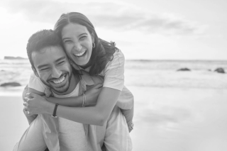 A black and white image of a smiling couple
