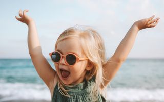 Image of a female kid at the beach.