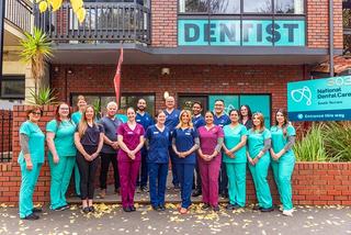Image of our dental team at National Dental Care South Terrace, standing in front of our dental clinic.