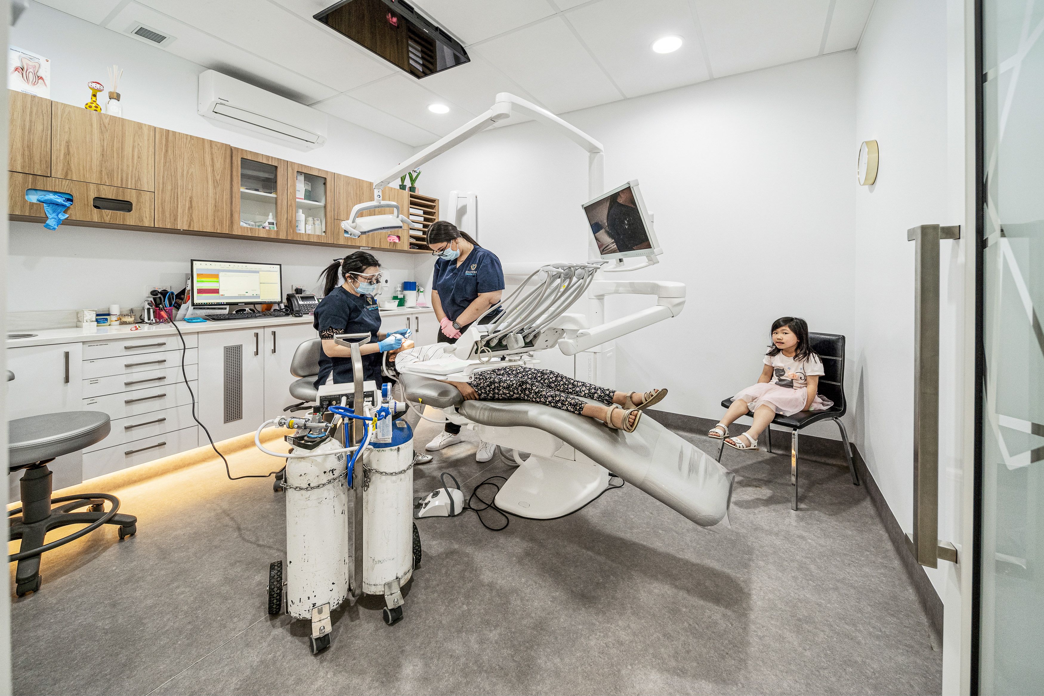 Image of our dentists caring for a patient in our dental chair at our Spearwood clinic.