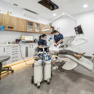 Image of our dentists caring for a patient in our dental chair at our Spearwood clinic.