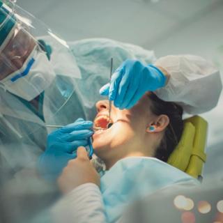 Image of a patient in a dental chair.