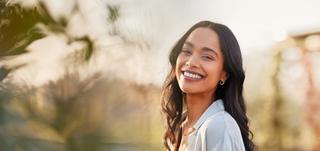 Female outdoors with beautiful white smile