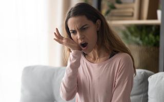 Patient expereincing pain from a damaged tooth