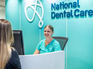 Image of our receptionist giving smiling at our new dental patient at National Dental Care Kadina.