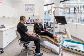 Dentist and patient talking at St Leonards dental clinic