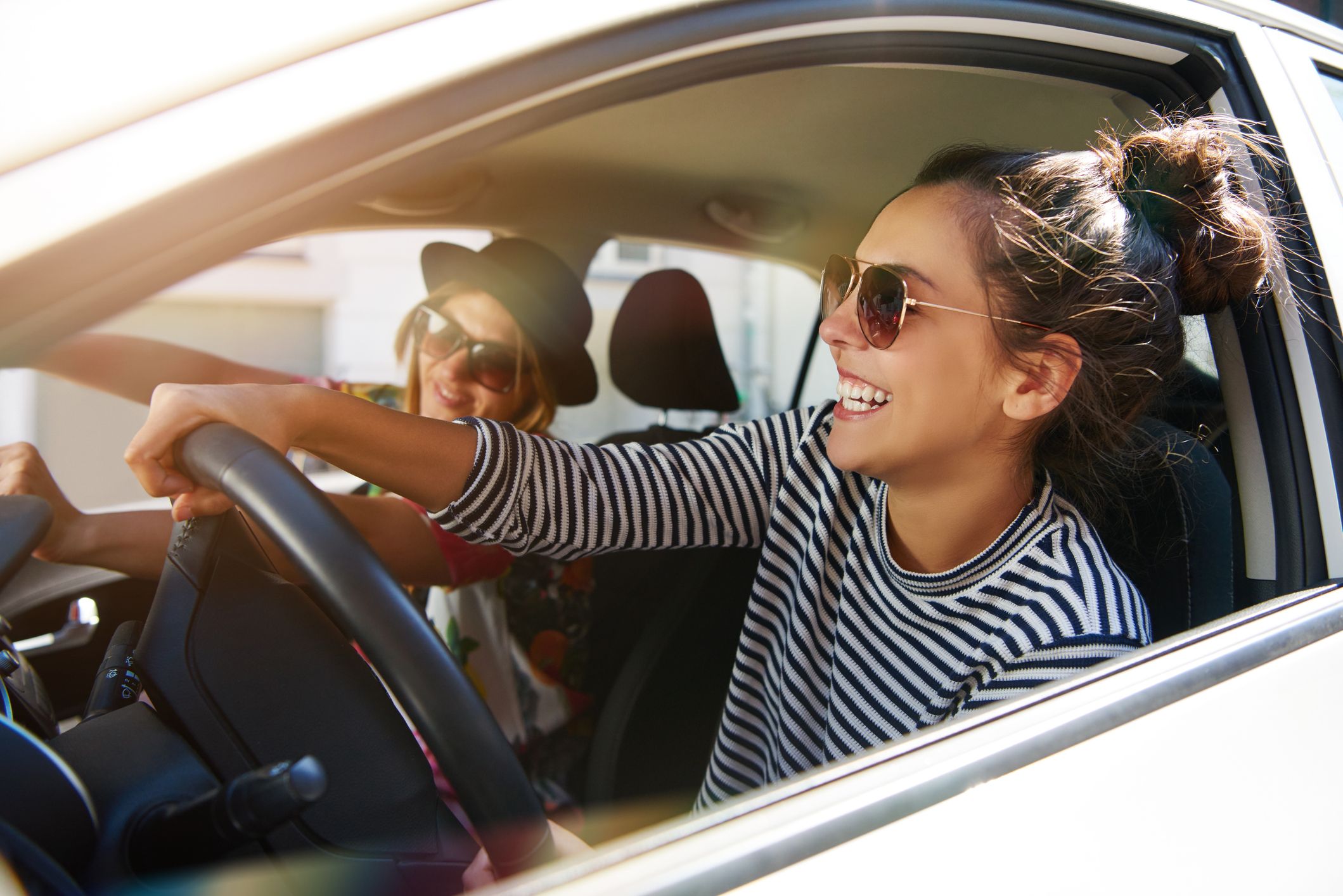 A pair of females driving to their dentist appointment