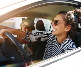 A pair of females driving to their dentist appointment