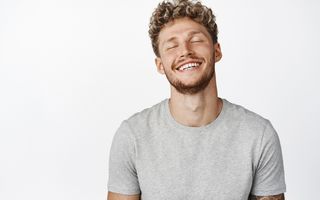 Image of a young man being happy with nice white teeth.