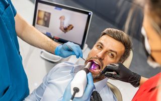 Image of a Intraoral Camera in a patient's mouth.