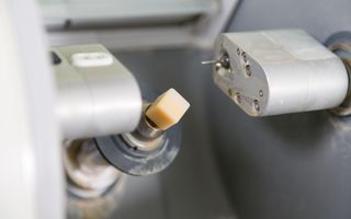 CEREC (CAD/CAM) milling machine ready to mill a tooth from porcelain