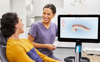 Dentist walking through iTero scanning technology