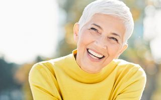 Image of a mature woman who is showing off her great teeth with a smile.