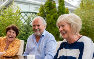 Image of senior patients outside with their beaming smiles