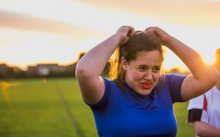 Female wearing a custom-fitted mouthguard for sport