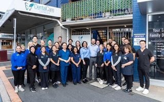 Image of the DentalCare Carnegie team in front of their dental practice.
