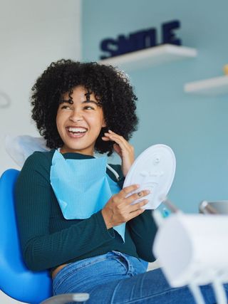 Smiling dental patient post-appointment