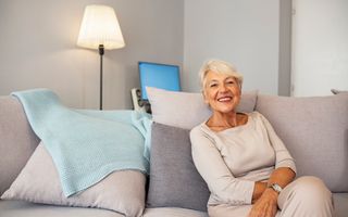 Older women sitting in on the sofa
