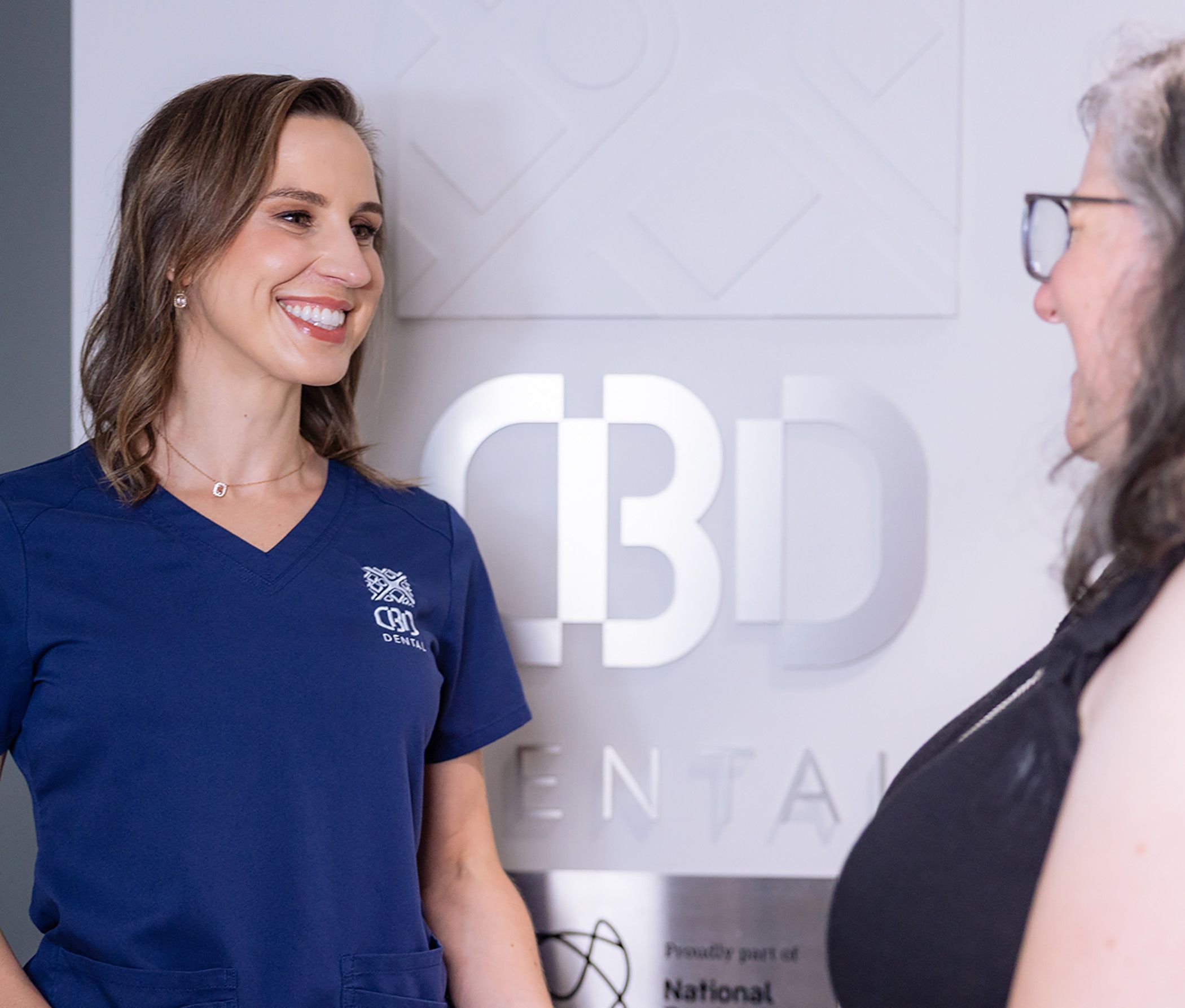 Image of our CBD Dental dentist comforting a patient. 