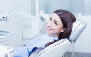 Woman smiling in the dental chair