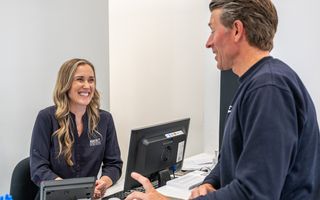 Image of our receptionist at Martin Street Dentist welcoming a new patient.