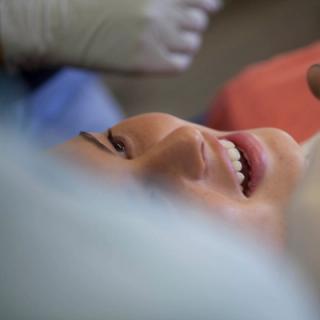 A dentist with his patient discussing future treatments.