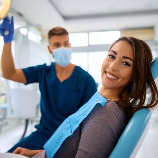 Image of a patient with her dentist undergoing a dental procedure.
