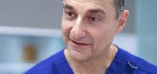 Image of Dr Len Hoffenberg with his patient at CBD Dental in Sydney.