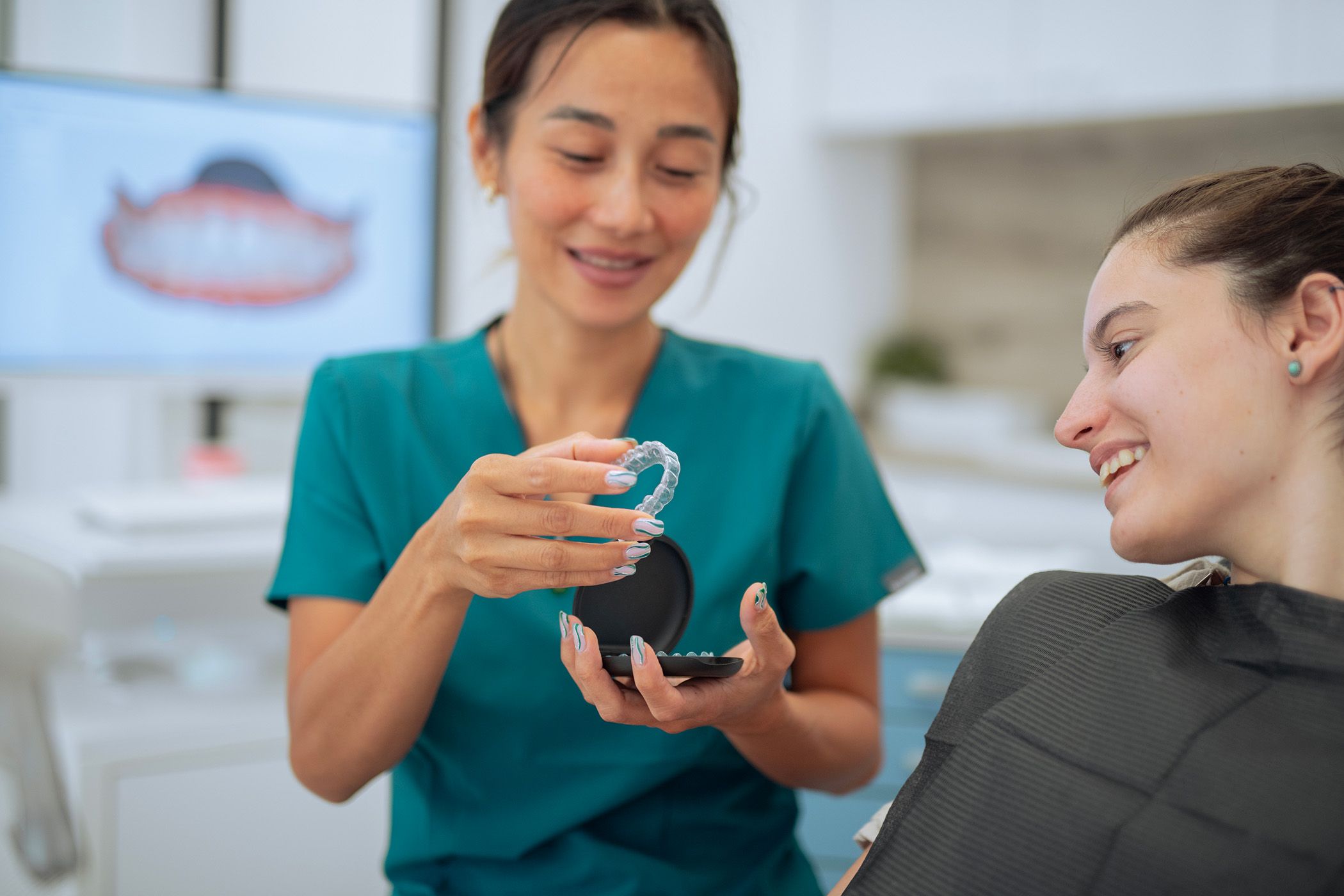 Woman trying on her clear aligners