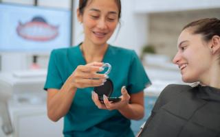 Woman trying on her clear aligners