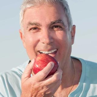 Man eating an apple