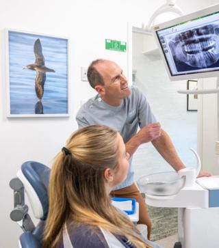 Image of a young patient with our dentist on Martin Street Dentist.