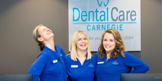 Image of the DentalCare Carnegie team in the receptionist area of the dental clinic.