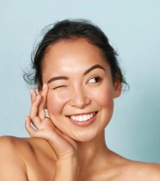Female enjoying her newly whitened teeth
