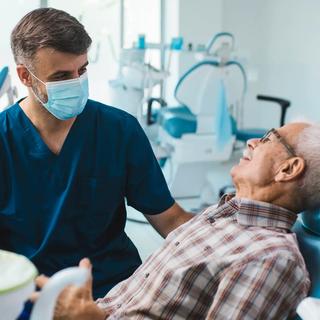 Patient having a comprehensive dental examination with dentist