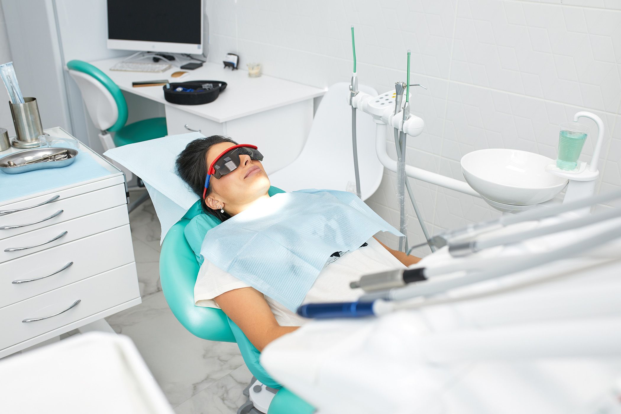 Image of a women relaxing in a dentist chair.