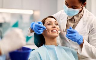 Patient dicsussing dental treatment with a dentist