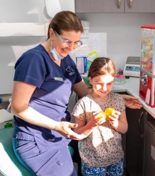 Image of a dentist managing a patient with dental anxiety.
