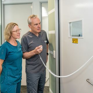 Our dentists and staff outside of a x-ray room.