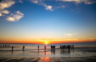 Image of a sunset over a beach at Darwin.
