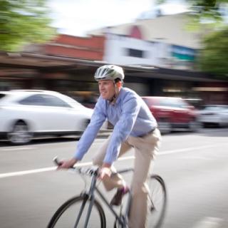 Image of Dr Nichols riding to his practice from home.