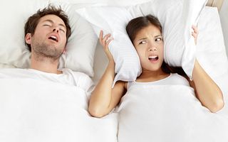 Stock image of young female suffering from a headache
