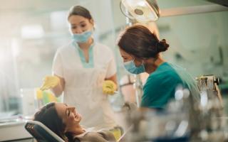 an image of a female patient with her hygienist