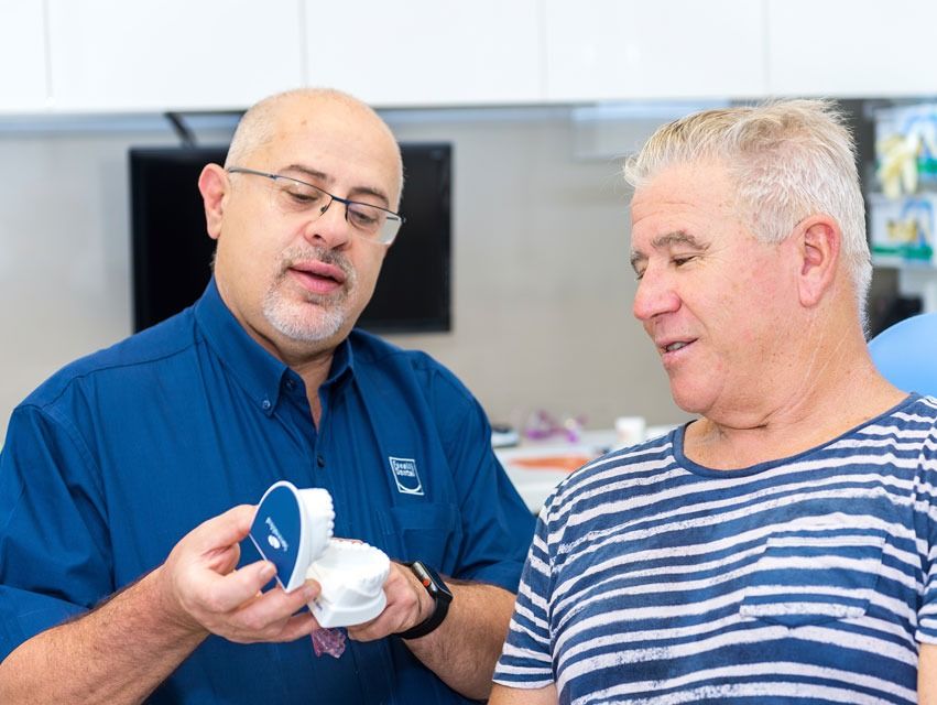 Our Gladstone lead dentist, Dr Fanelli with a patient