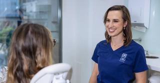 Image of Dr Angela Rigo with her patient in our Sydney CBD dental clinic.