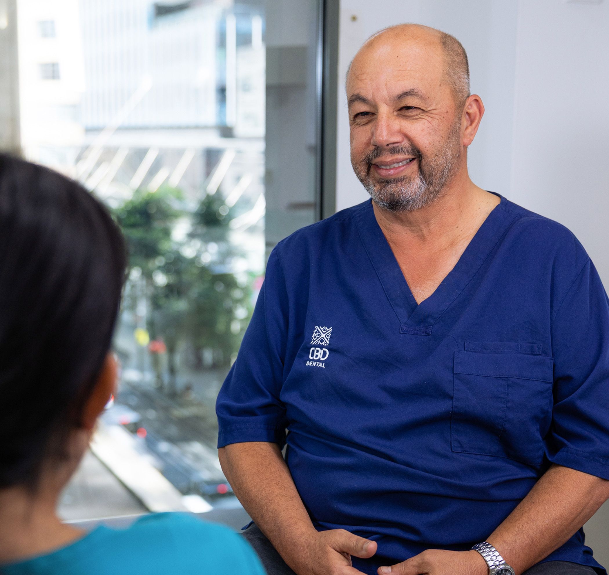 Image of our CBD Dentist discussing teeth whitening options with his patient.