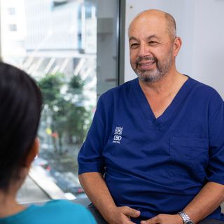 Image of our CBD Dentist discussing teeth whitening options with his patient.