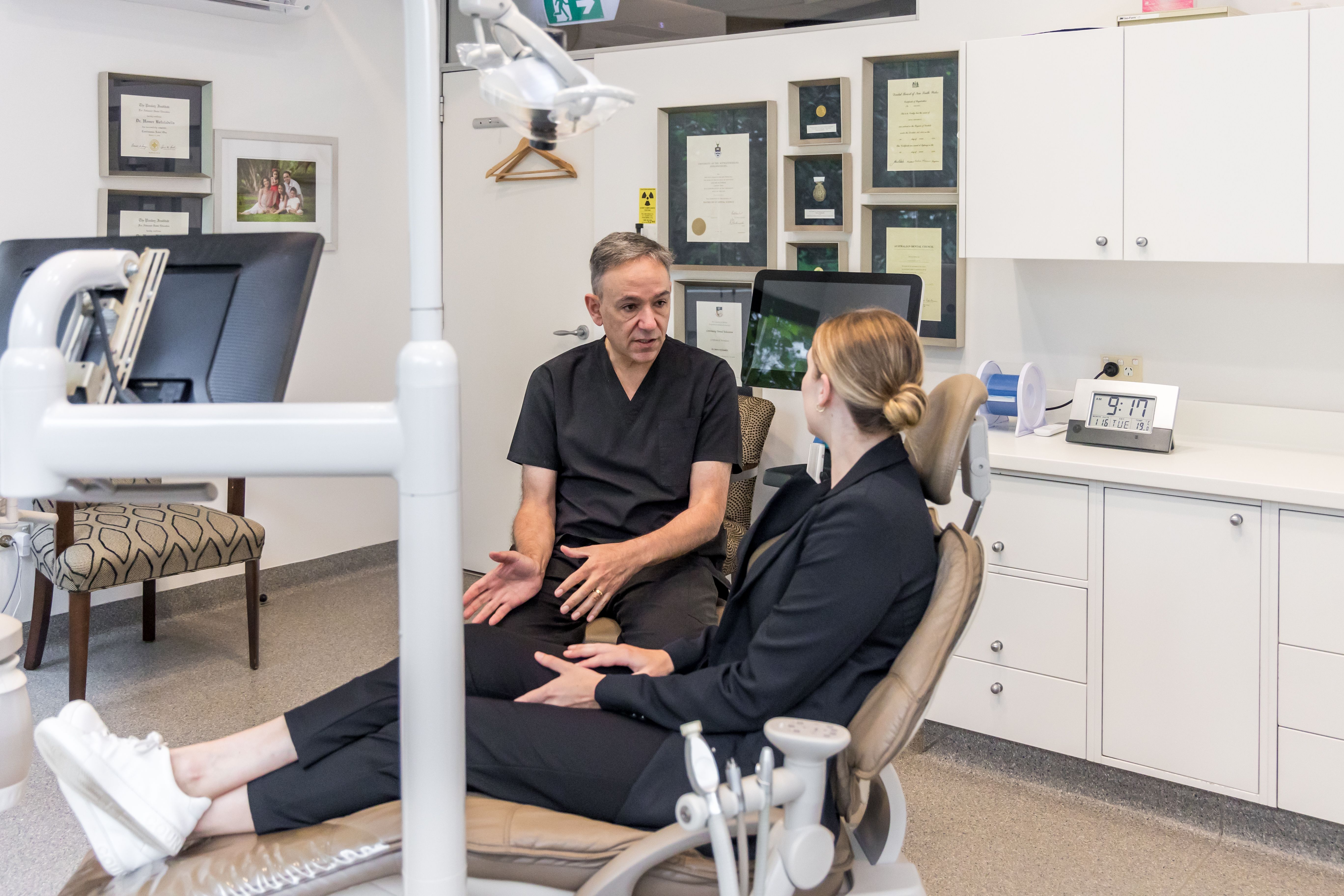 Image of one of CBD Dental's patient learning about Invisalign with our dentist.